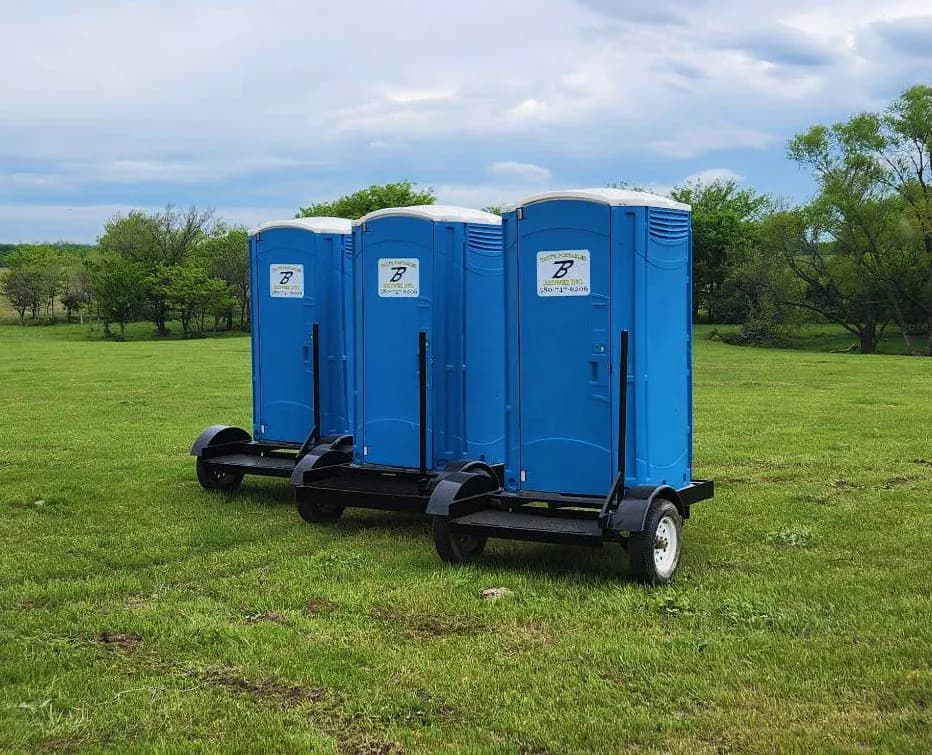 Brower Inc. ADA-compliant portable restroom trio mounted on trailer in Newkirk, Oklahoma
